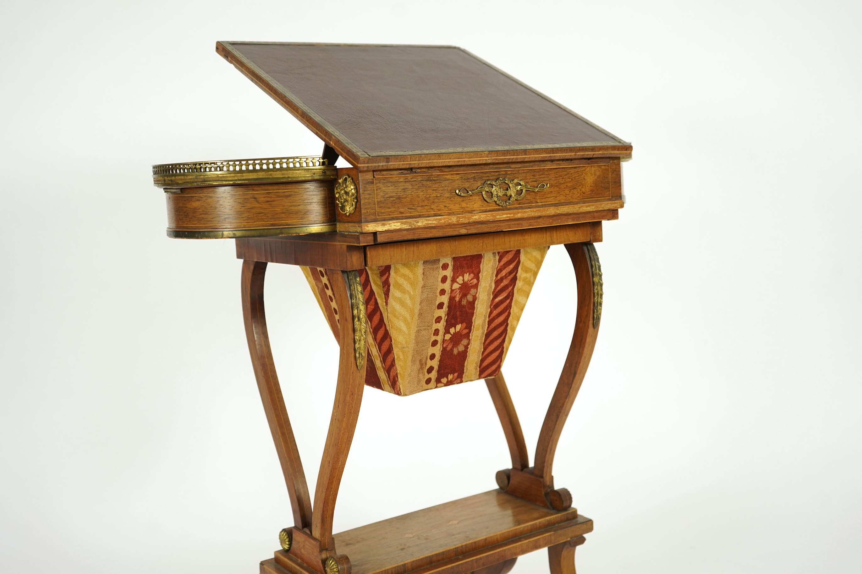 A Regency brass mounted rosewood writing, games and work table